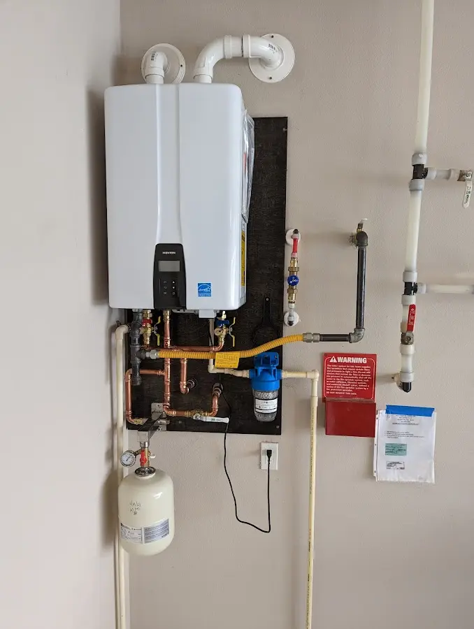 Professional plumber installing copper piping in a Schofield Barracks home